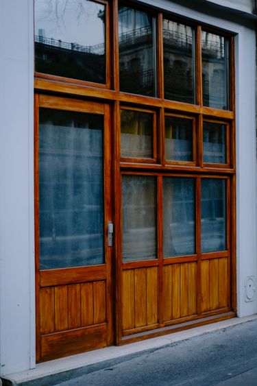 An entrance door stained to match the windows
